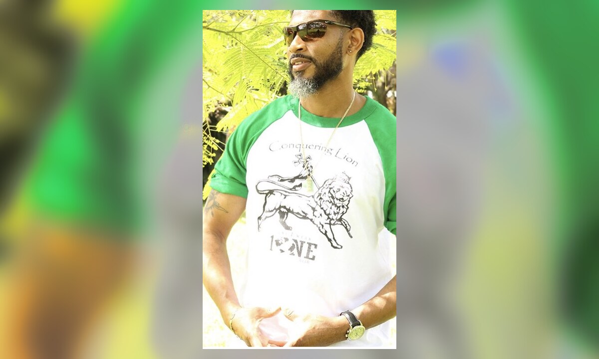 One Wear creator wearing the green-and-white Conquering Lion shirt